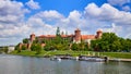 Wawel castle - famous landmark in Krakow Poland. Picturesque landscape on coast Vistula river during the sunny day Royalty Free Stock Photo