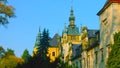 Wawel castle in Krakow, Poland. Towers . Picturesque territory in autumn day with yellow and green trees. Blue sky with clouds Royalty Free Stock Photo