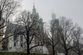 Wawel Castle in the morning fog in Krakow, Poland Royalty Free Stock Photo