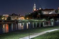 Wawel castle and vistula, Wisla, river night panorama, Poland, Krakow Royalty Free Stock Photo