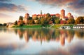 Wawel hill with castle in pink light of sunset, Krakow, Poland