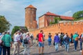 Wawel Royal Castle, group of tourists walking to the palace complex main gate