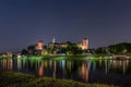 Wawel Royal Castle surrounded by a lake in the evneing in Krakow, Poland Royalty Free Stock Photo