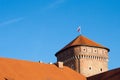 Wawel Royal Castle. Thieves Tower with the flag of Poland on the top Royalty Free Stock Photo