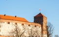 Wawel Royal Castle. Thieves Tower with the flag of Poland on the top