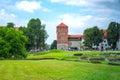 Wawel Royal Castle, view of Thieves Tower, tourists walking around the meadows and lawns Royalty Free Stock Photo