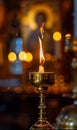 wax candle burning in church on dark background, flame and candlelight, religion and christianity concept Royalty Free Stock Photo