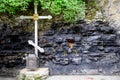 Wax church candles in rock niches. Holy place