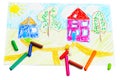 Wax crayons and a children's drawing. Royalty Free Stock Photo