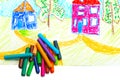 Wax crayons and a children's drawing. Royalty Free Stock Photo