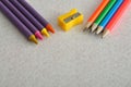 Wax crayons, a writing pencils and a sharpener