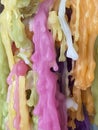 Wax droplet closeup. Colorful melted candle drips in shape of solid drops. Pastel shades abstract wax texture.