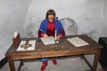 Wax figure of old clerk in museum of Baturin. Portrait of clerk with pen in his hand