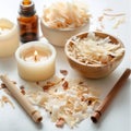 Wax flakes, essential oil and wooden wicks on white background, making homemade candle