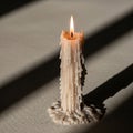 The wax pool at the base creates an uneven texture, reflecting the light Royalty Free Stock Photo