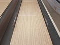 Waxed wooden bowling alley lanes with bumpers