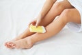 Waxing. Beautician Waxing Woman`s Leg In Spa Salon Royalty Free Stock Photo