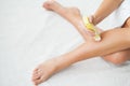 Waxing. Beautician Waxing Woman`s Leg In Spa Salon Royalty Free Stock Photo