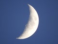 Waxing crescent moon phase in NYS evening sky Royalty Free Stock Photo