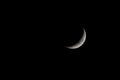 Waxing Crescent Moon Phase isolated on black Royalty Free Stock Photo