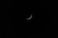 Waxing Crescent moon with star against black sky Royalty Free Stock Photo