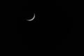 Waxing Crescent moon with star against black sky Royalty Free Stock Photo