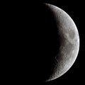 Waxing crescent Moon through a telescope Royalty Free Stock Photo