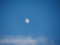 Waxing gibbous moon over blue sky