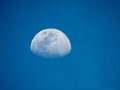 Waxing gibbous phase of the moon on a blue sky at daytime