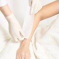 Waxing woman body. Sugar hair removal. laser service epilation. Salon wax beautician procedure Royalty Free Stock Photo