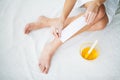 Waxing. Young Woman Depilating Her Leg With Wax Stripe Royalty Free Stock Photo