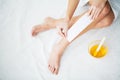 Waxing. Young Woman Depilating Her Leg With Wax Stripe Royalty Free Stock Photo