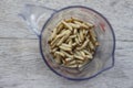 Waxworms in a measuring cup Royalty Free Stock Photo