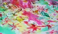 Watercolor star paint green pink yellow blurred waxy gold spots colorful hues, strokes of brush, backgrounnd Royalty Free Stock Photo