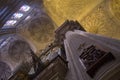 Way of the cross in a pillar, vaults and stained glass windows in a cathedral