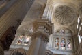 Way of the cross, pillar, vaults and stained glass windows in a Malaga cathedral
