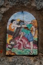 Way of the cross. 7th Station. Jesus falls for the second time. Hand painted ceramic tile, Ingurtosu, Arbus, South Sardinia