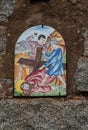Way of the cross. 9th Station. Jesus falls for the third time. Hand painted ceramic tile, Ingurtosu, Arbus, South Sardinia