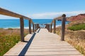 Way down to Amado Beach, wooden boardwalk and sea view, west algarve portugal Royalty Free Stock Photo