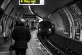 Man walking towards Way Out on London underground