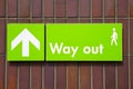 Way out sign with green background and white writing