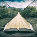 Way by the suspension bridge on the pages of book, vintage Royalty Free Stock Photo