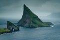 On the way to one of the most famous places in the Faroe Islands, the Drangarnir rock formation with the iconic hole in the cliff Royalty Free Stock Photo