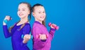 On way to stronger body. Girls exercising with dumbbells. Beginner dumbbells exercises. Sporty upbringing. Children hold