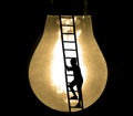 Way to success, education and creative grow idea concept with black silhouette of young male boy climbing ladder to big Royalty Free Stock Photo