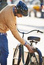 The only way he travels in the city. a handsome man about to take a ride on his bicycle in the city. Royalty Free Stock Photo