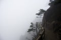 Foggy Rainny day. Stone Steep Steps . Treking walking hking Huangshan Mountain. Anhui, China. April 2009 Royalty Free Stock Photo