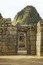 Wayna Picchu behind ruins of doors inside Machu Picchu Royalty Free Stock Photo