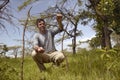 Wayne Pacelle CEO of Humane Society of United States checking snare trap for animals in Tsavo National Park, Kenya, Africa Royalty Free Stock Photo