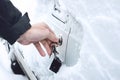 Ways to Open Frozen Car Doors. heating up the key. Male hand opening winter car door with keys, selective focus. Opening,